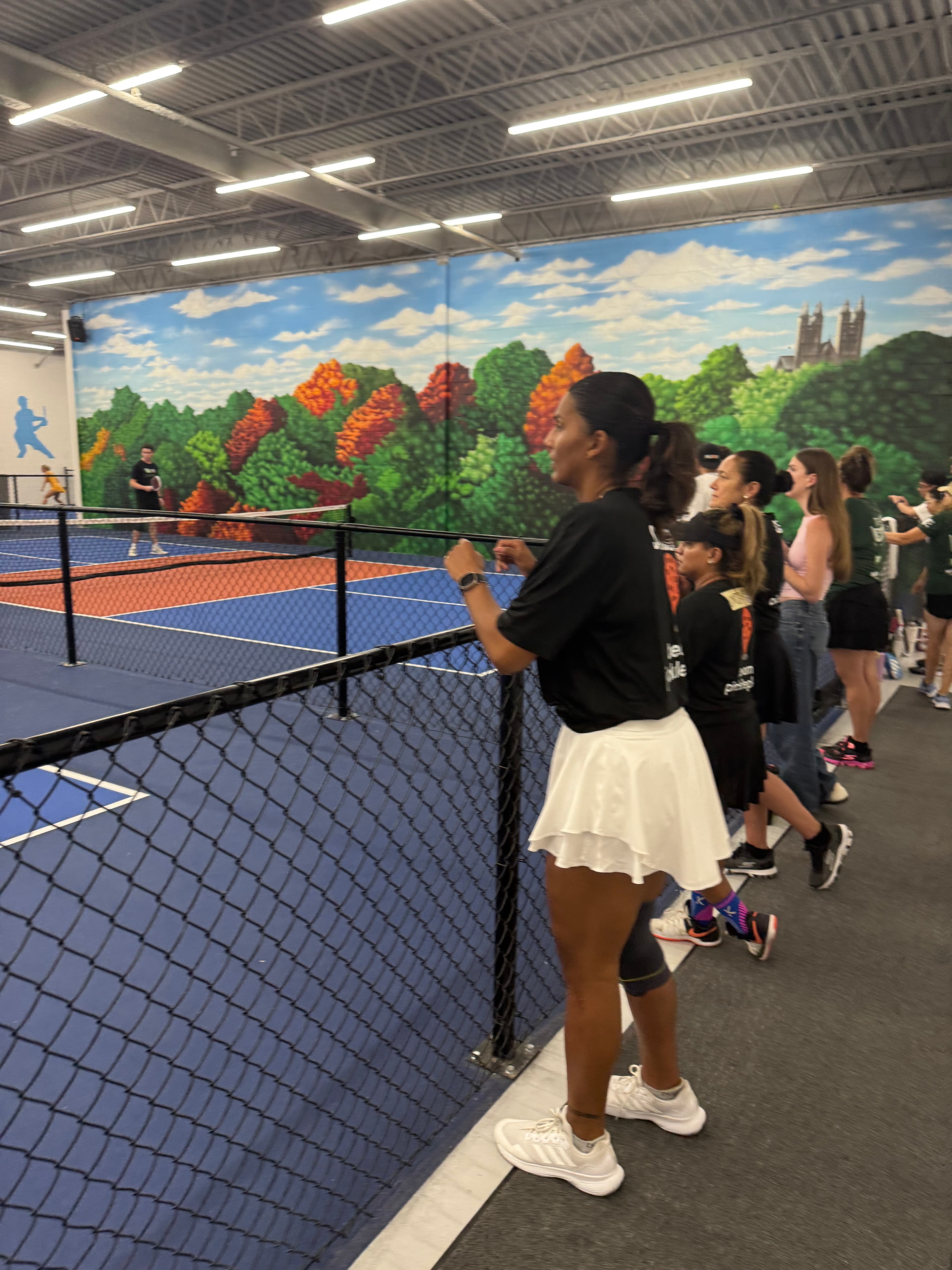 Spectators at a vibrant pickleball venue